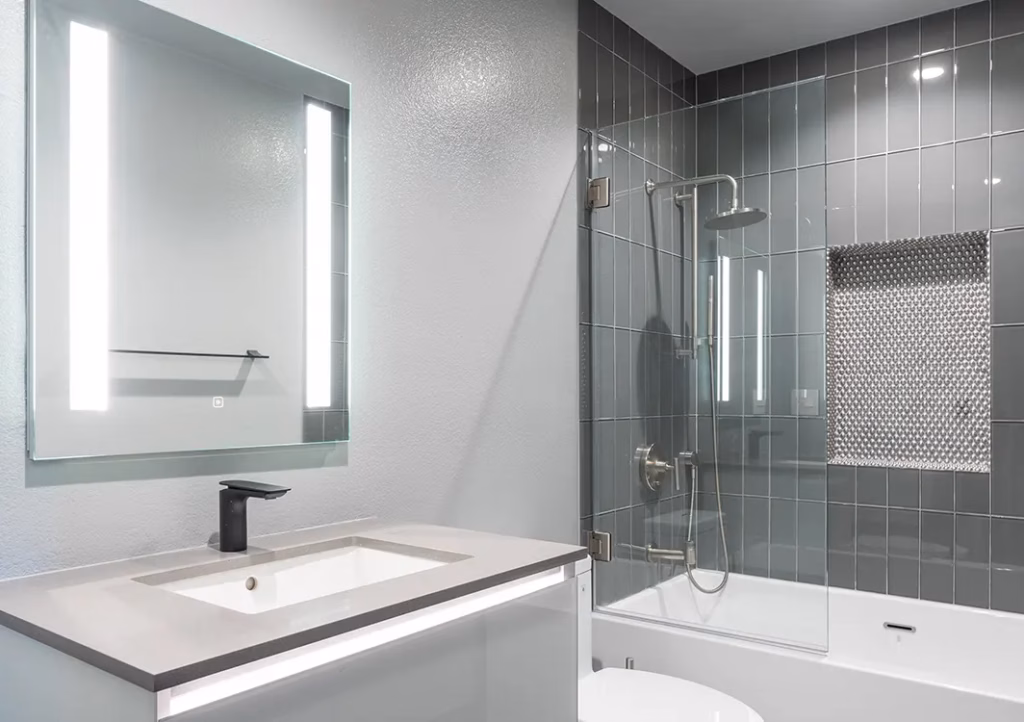 Modern bathroom with glass shower and floating vanity